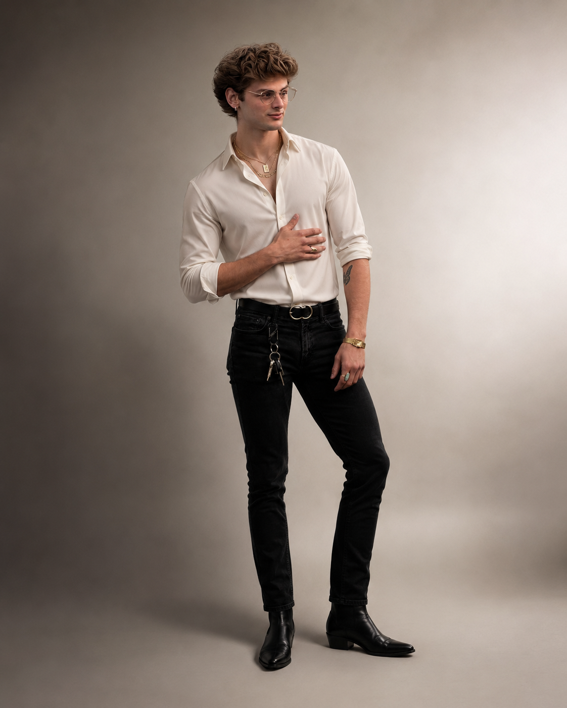 Cooper Baker in a white shirt, black jeans, and boots